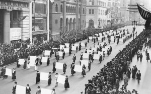 Suffragists parade down Fifth Avenue, October 1917, displaying placards containing the signatures of more than one million New York women demanding the vote. The New York Times Photo Archives