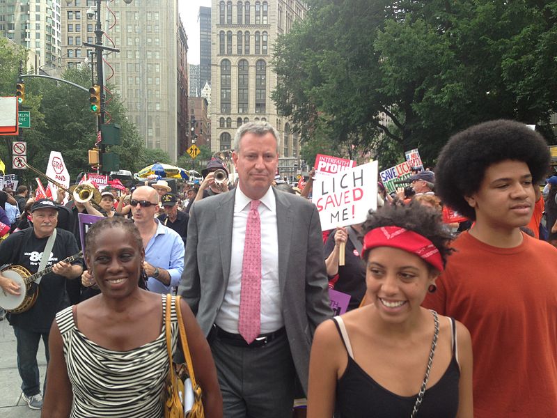 Public Advocate Bill de Blasio today joined doctors, nurses, health care workers and activists at a major rally to protest the closure of Long Island College Hospital and Interfaith Medical Center. Seen here with his wife, Chirlane, and kids, Chiara and Dante. Image via Wiki.