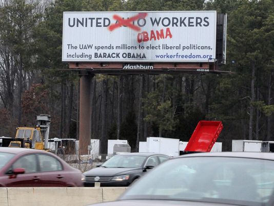 An anti-UAW union message is visible on a billboard for northbound motorists in Chattanooga, Tenn. The sign misspells the word politician. Photo: Tim Barber, Chattanooga Times Free Press/USA Today